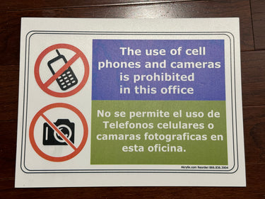The Use of Cell Phones and Cameras is Prohibited in This Office Sign (English & Spanish)